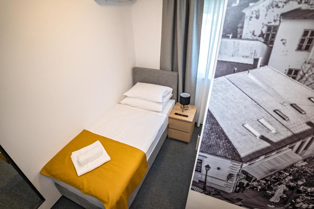 Postel nebo postele na pokoji v ubytování KM therooms BJELOVAR