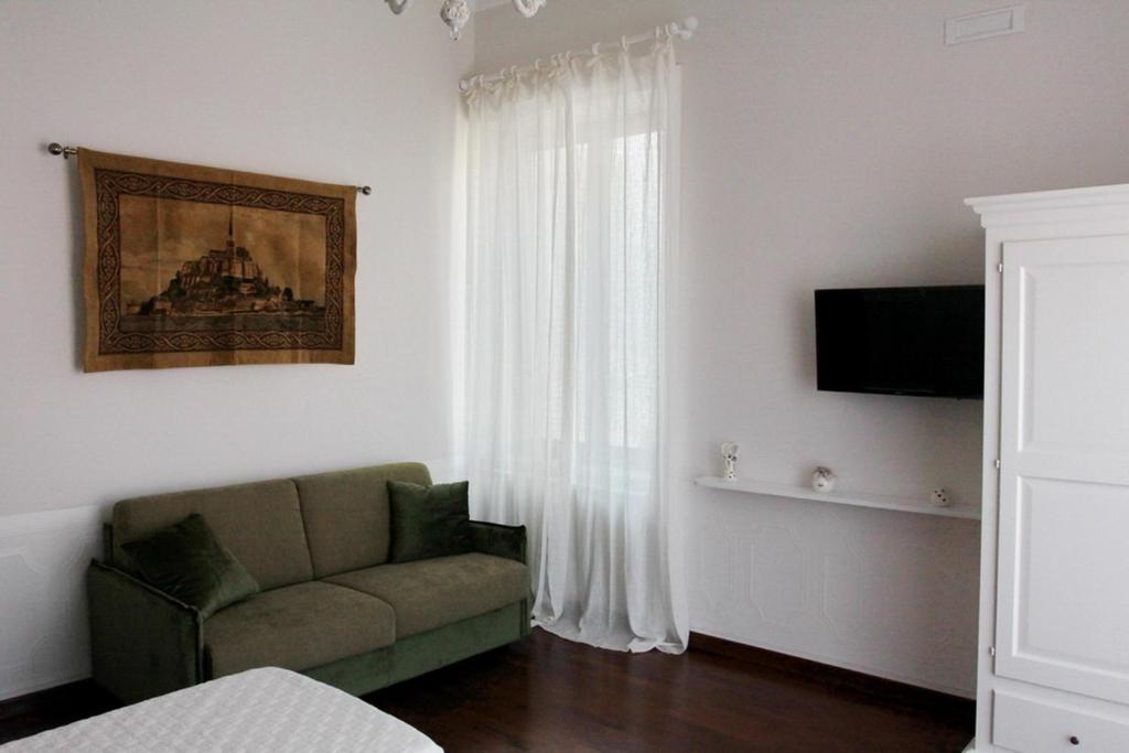 TV a/nebo společenská místnost v ubytování Casa Parthenope