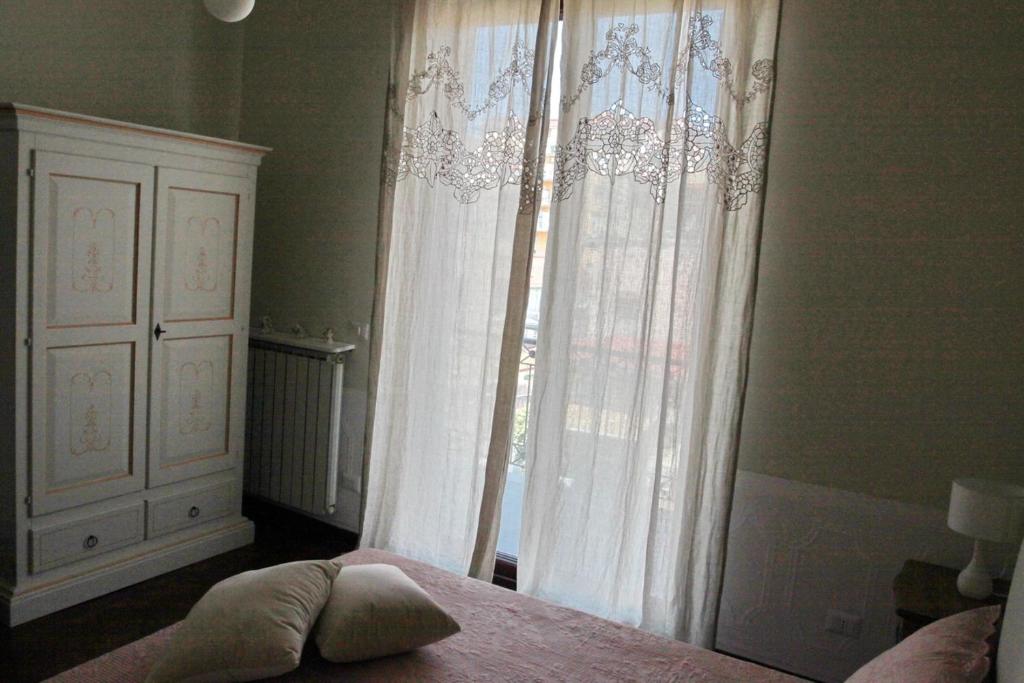 Postel nebo postele na pokoji v ubytování Casa Parthenope