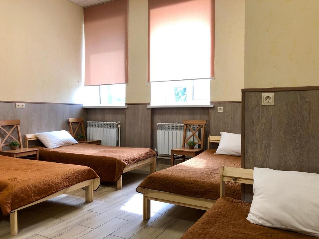 Кровать или кровати в номере Гостиница Атмосфера