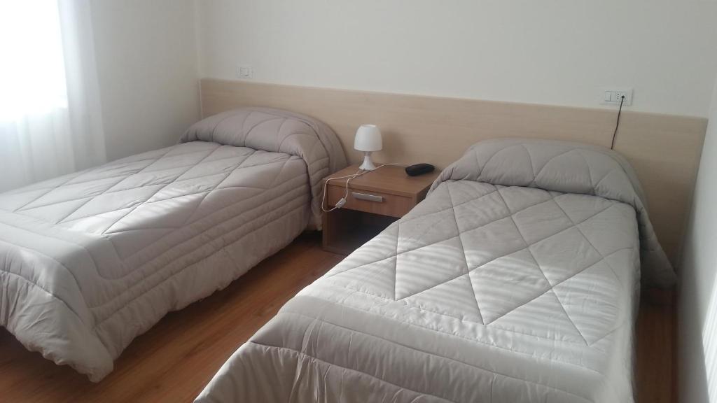 Postel nebo postele na pokoji v ubytování Hotel Gronda Lagunare