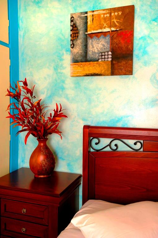 Postel nebo postele na pokoji v ubytování Pergamos Hotel