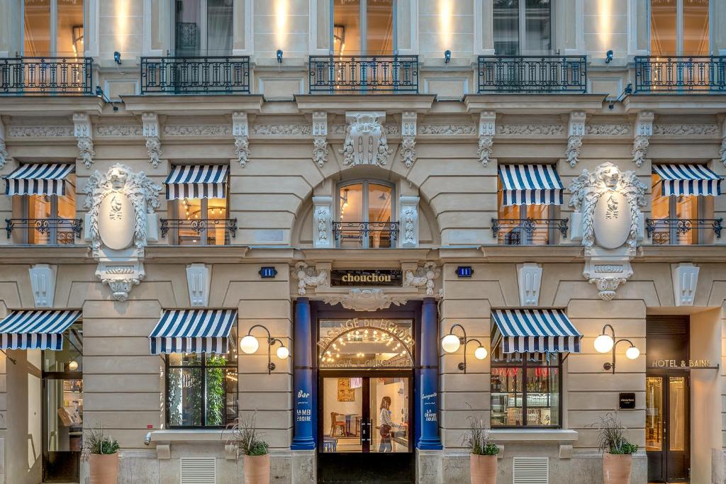 a facade of a building with windows and balconies at Chouchou Hotel in Paris