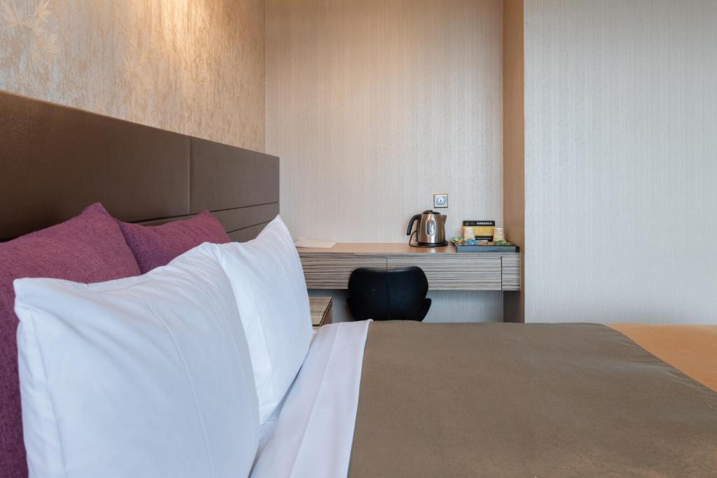Postel nebo postele na pokoji v ubytování 覓玥精品時尚旅館 Mi Yue Boutique Motel