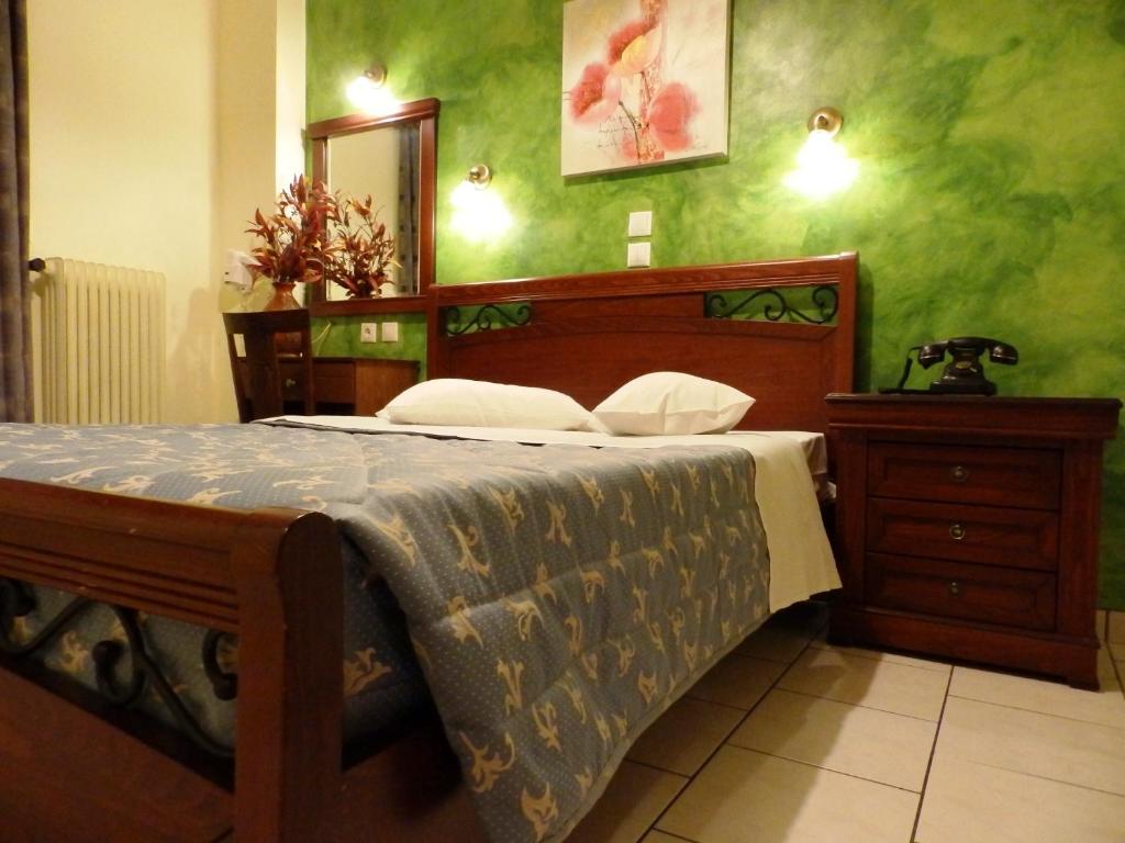 Postel nebo postele na pokoji v ubytování Pergamos Hotel