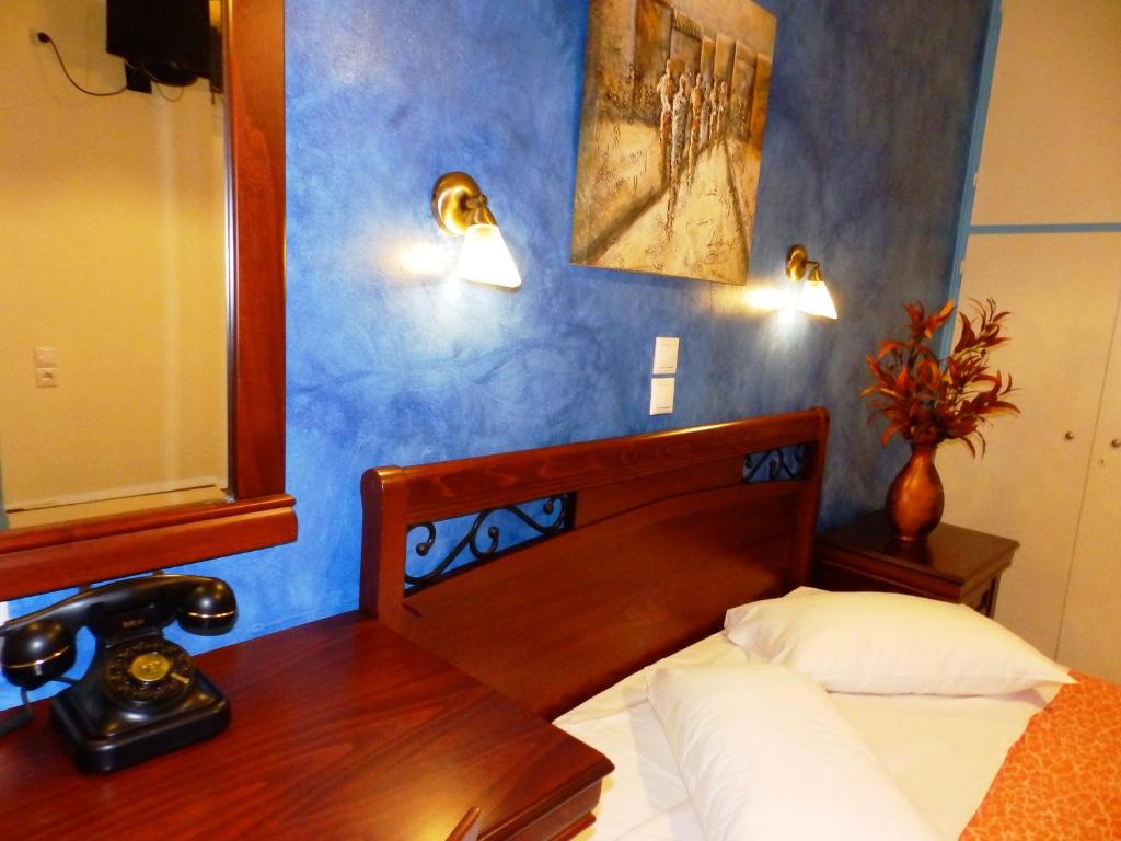 Postel nebo postele na pokoji v ubytování Pergamos Hotel
