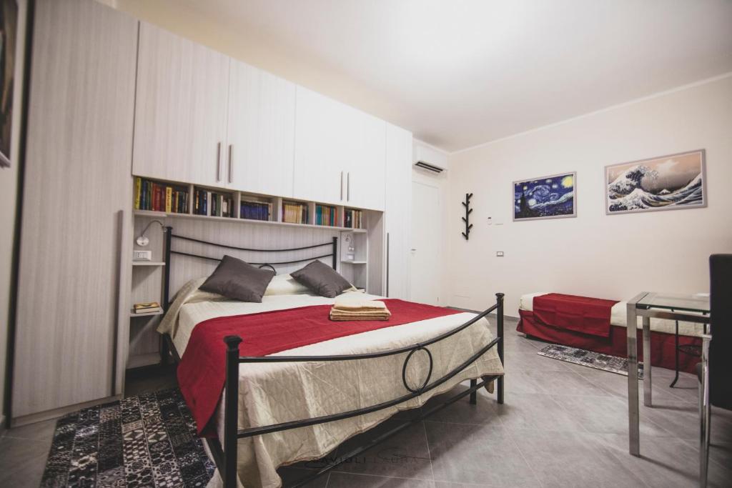 A bed or beds in a room at ART & BOOKS bed and breakfast