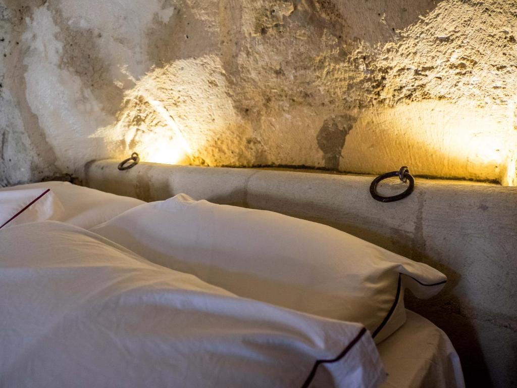 Postel nebo postele na pokoji v ubytování ENOTRIO Barisano