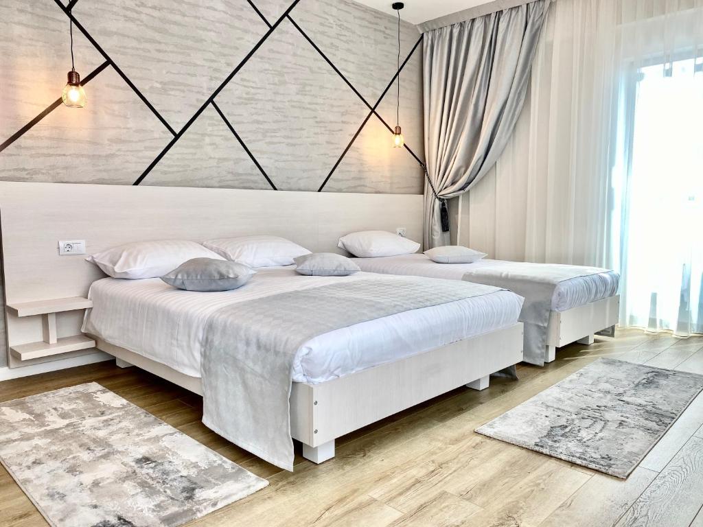 Postel nebo postele na pokoji v ubytování Hotel Bulevard