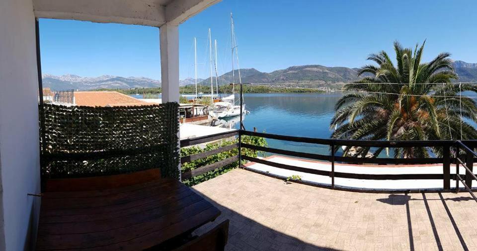 a balcony with a view of a body of water at Apartments Odzic in Tivat