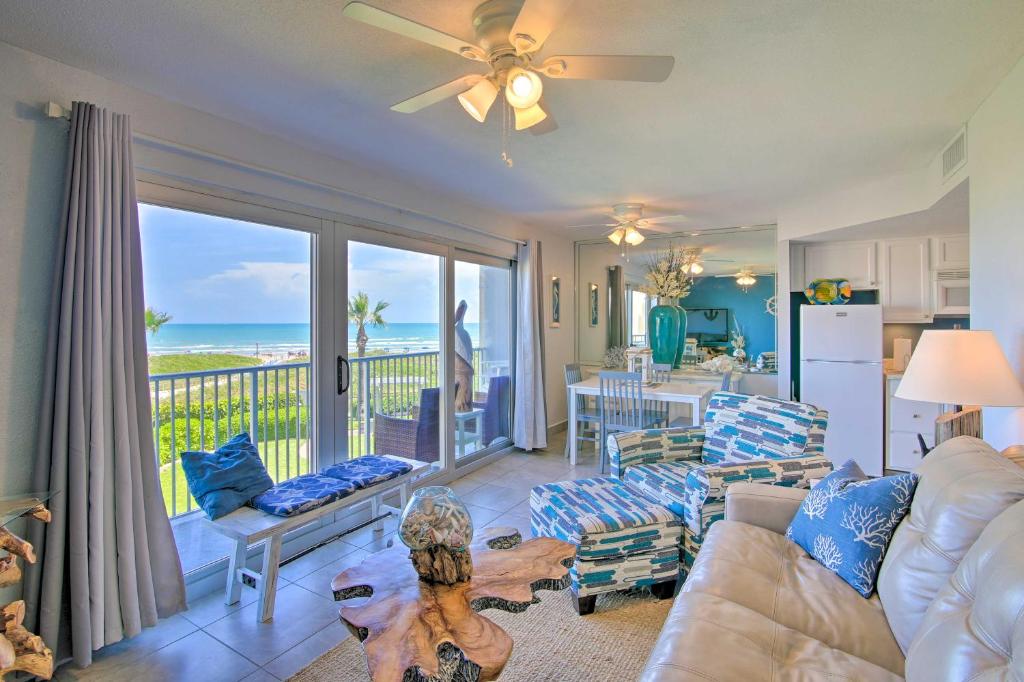 a living room with a view of the ocean at Oceanfront Unit with Gulf View by Bayside Attractions in South Padre Island