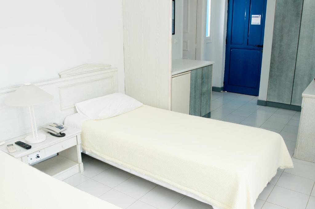 Postel nebo postele na pokoji v ubytování El Sol Hotel