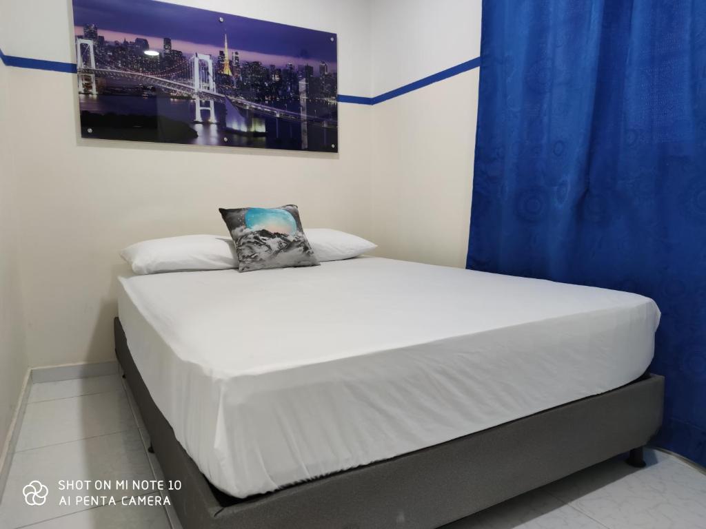 Postel nebo postele na pokoji v ubytování Casa Hotel Manco Mora