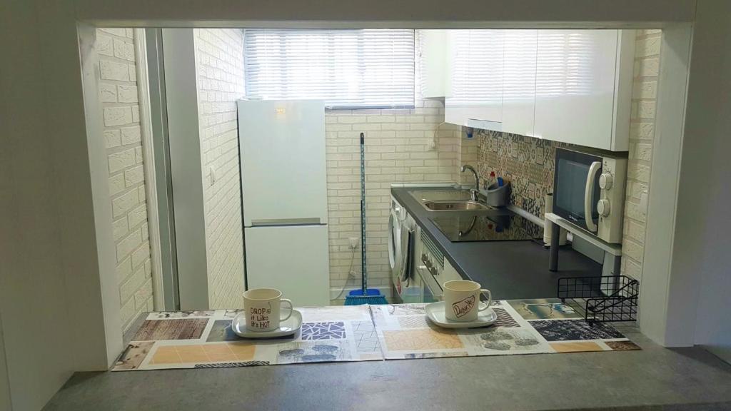 Kuchyň nebo kuchyňský kout v ubytování SweetWater Home - Apartamento ideal para tus vacaciones