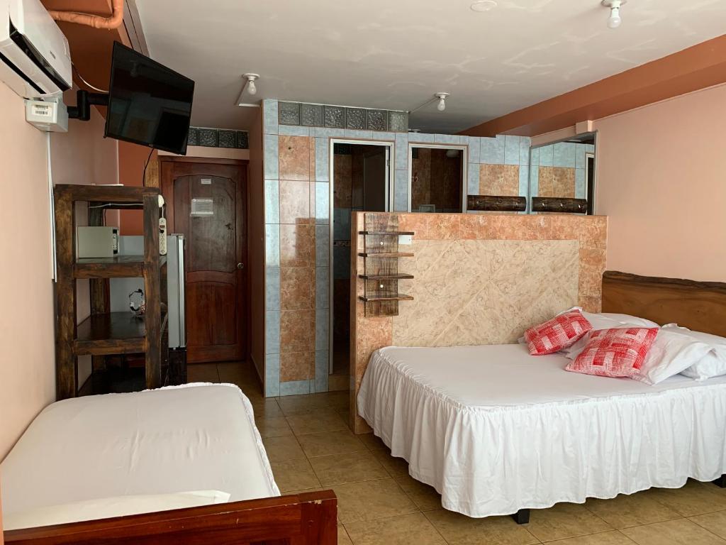 Postel nebo postele na pokoji v ubytování Hotel La Barca