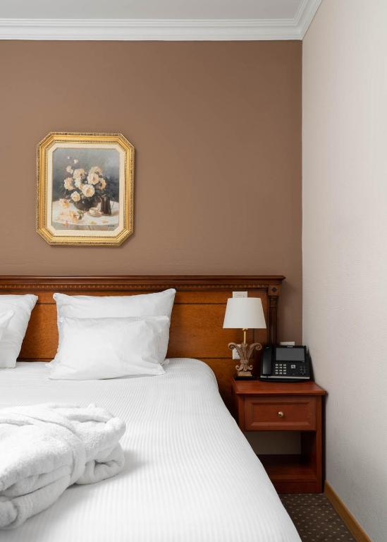 Postel nebo postele na pokoji v ubytování Hotel Le Rive