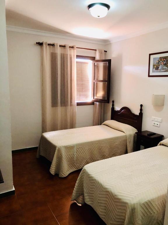 Postel nebo postele na pokoji v ubytování Hotel La Yedra