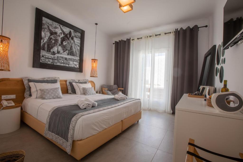 Postel nebo postele na pokoji v ubytování Harmony Boutique Hotel