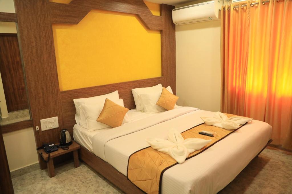 Postel nebo postele na pokoji v ubytování The K11 Hotels - T Nagar