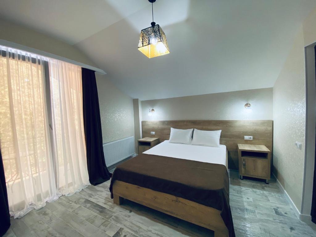 Postel nebo postele na pokoji v ubytování Villa Royal