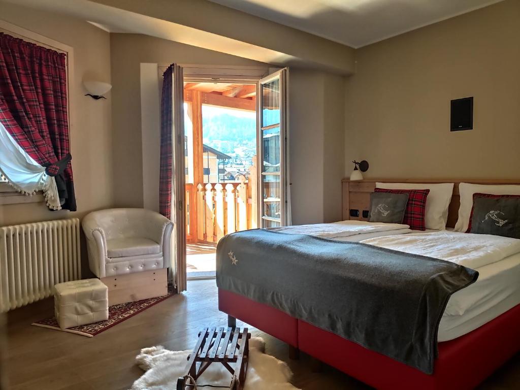 Postel nebo postele na pokoji v ubytování Hotel Astoria