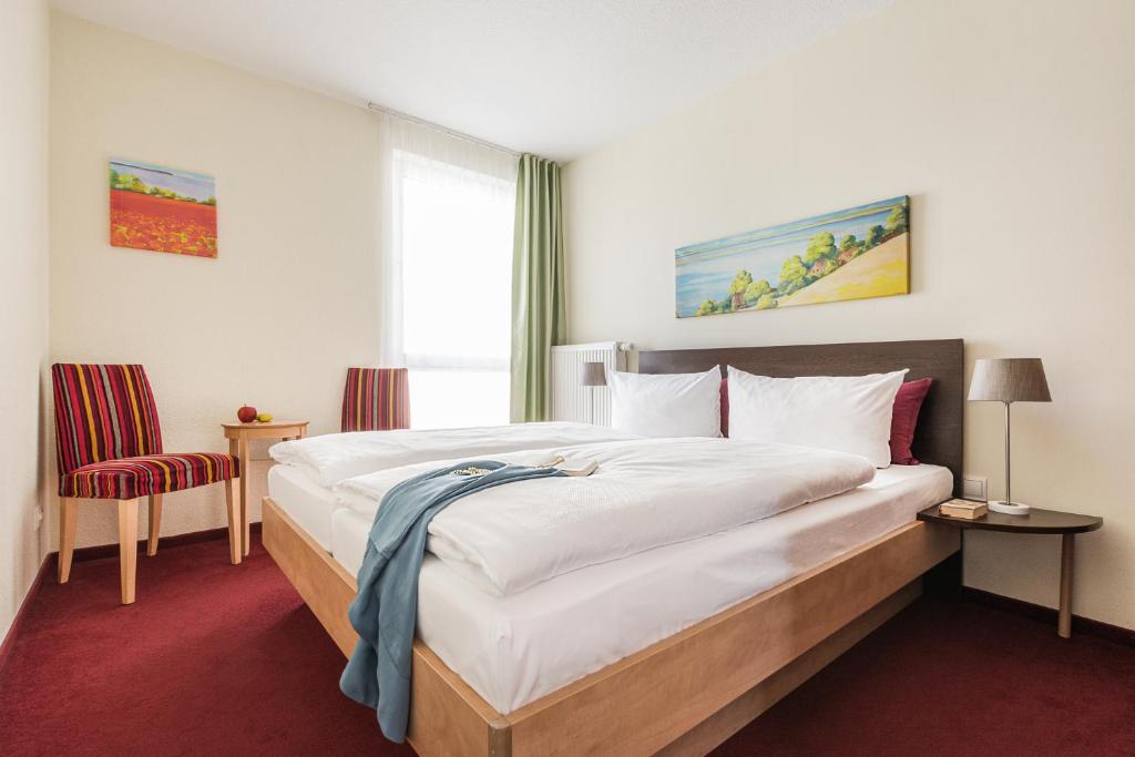 Postel nebo postele na pokoji v ubytování Familienhotel Villa Sano