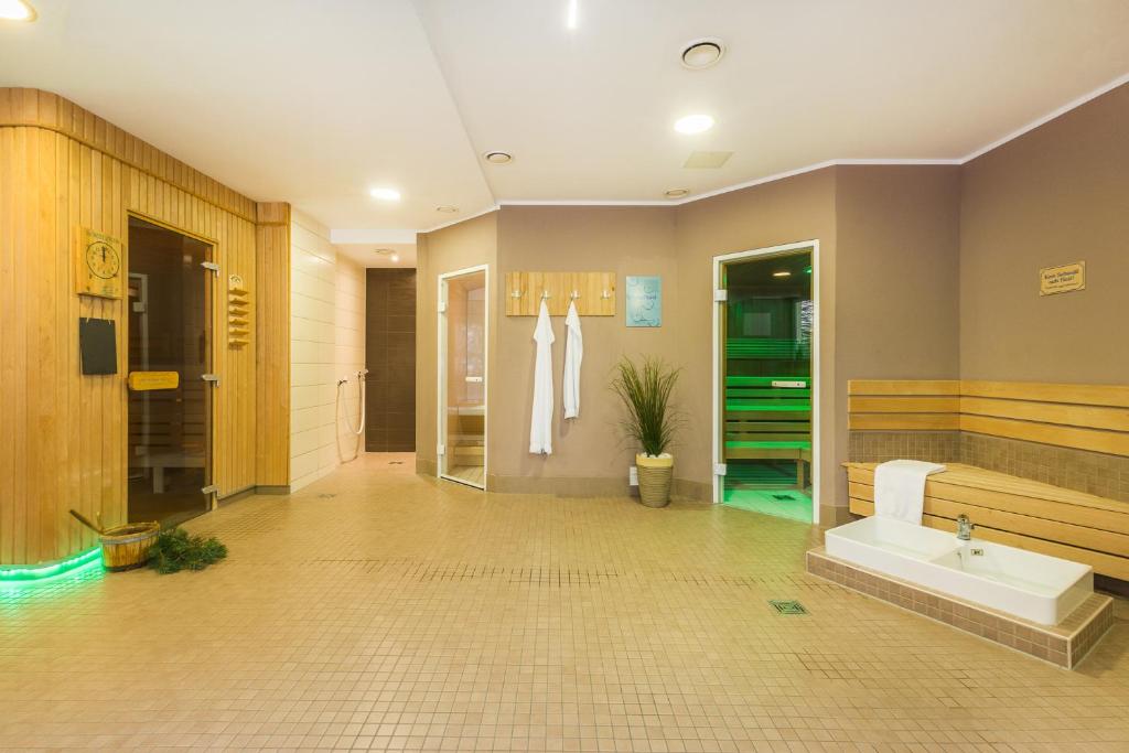 TV a/nebo společenská místnost v ubytování Familienhotel Villa Sano