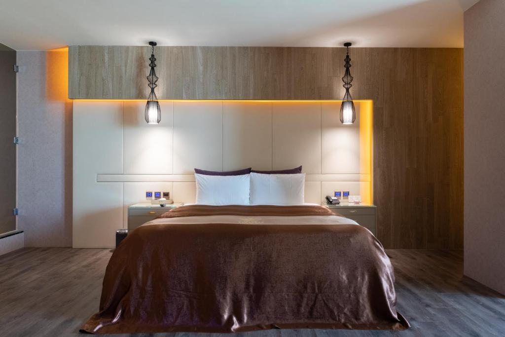 Postel nebo postele na pokoji v ubytování 覓玥精品時尚旅館 Mi Yue Boutique Motel