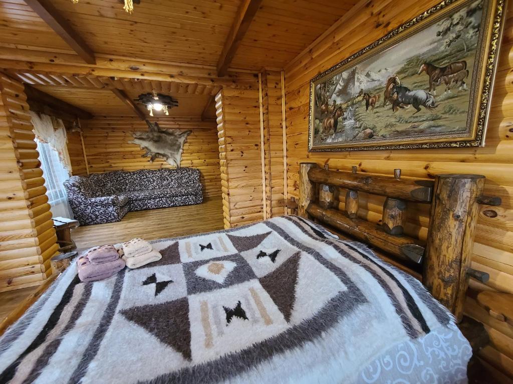 Postel nebo postele na pokoji v ubytování Гуцульська хата