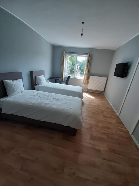Postel nebo postele na pokoji v ubytování Hotel Temse