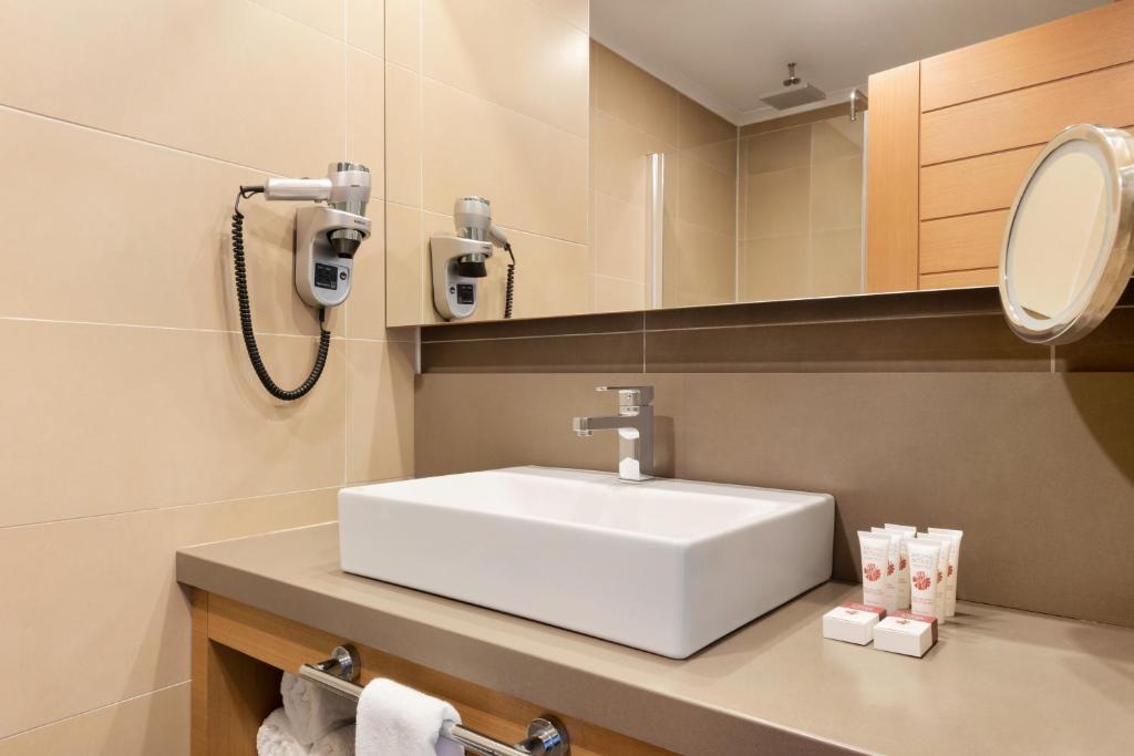 A bathroom at Ramada Resort by Wyndham Unye