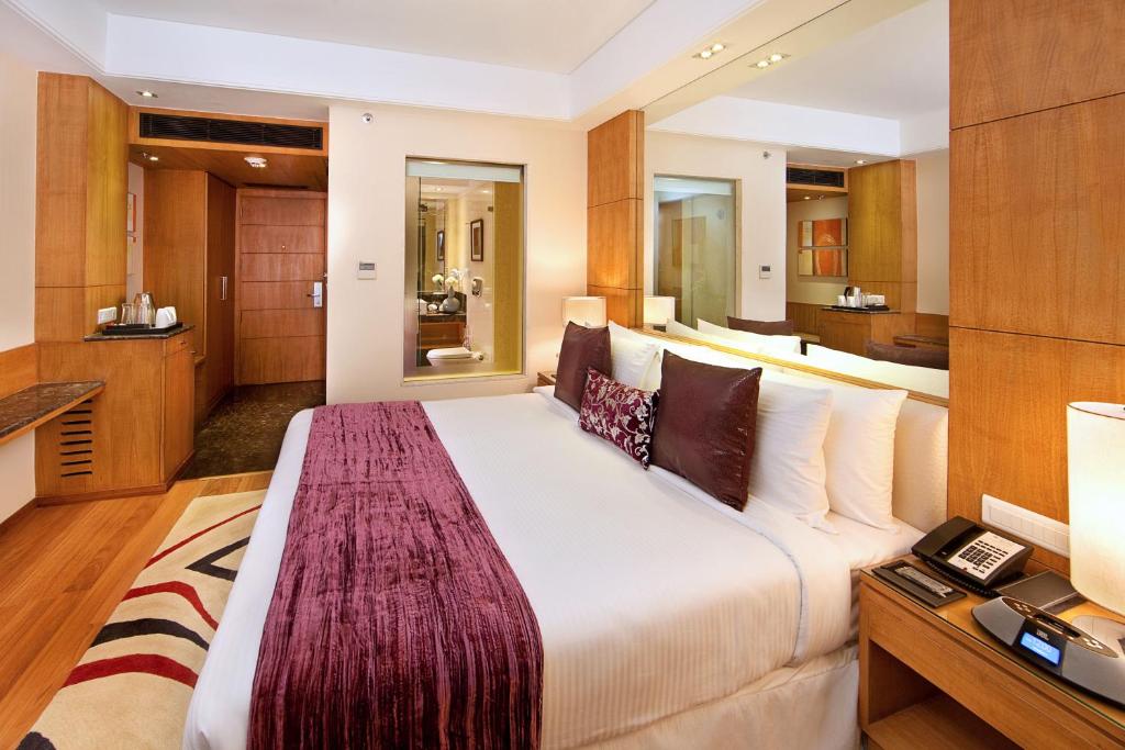 Voodi või voodid majutusasutuse The Place Gurugram, a member of Radisson Individuals toas