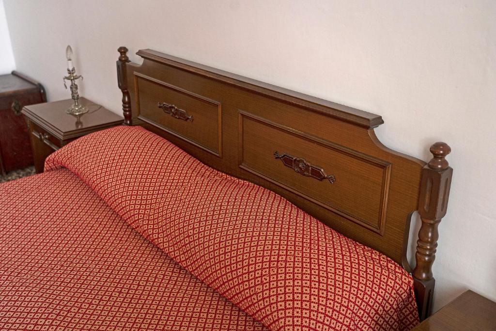 A bed or beds in a room at La Perpetua