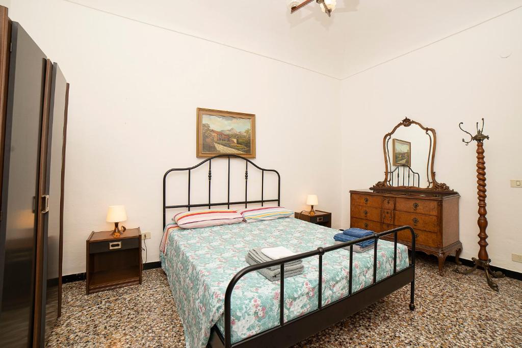 A bed or beds in a room at La Perpetua