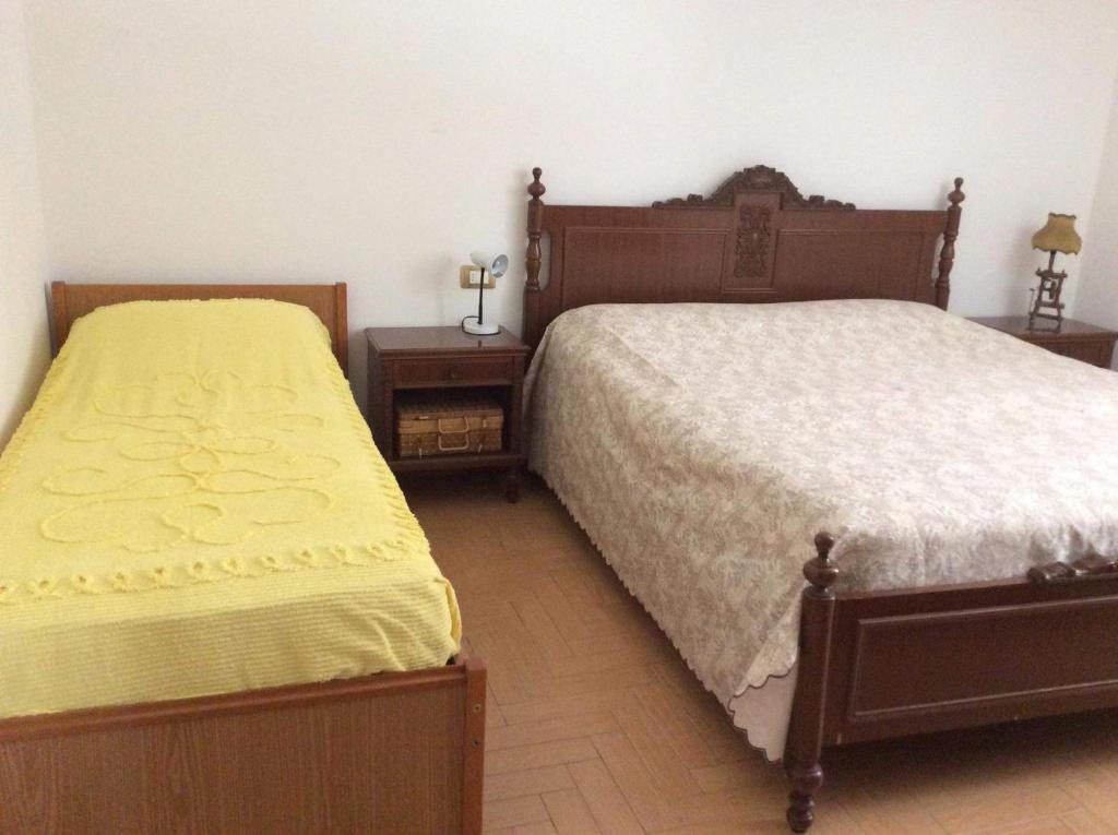 Кровать или кровати в номере Perla nelle Orobie