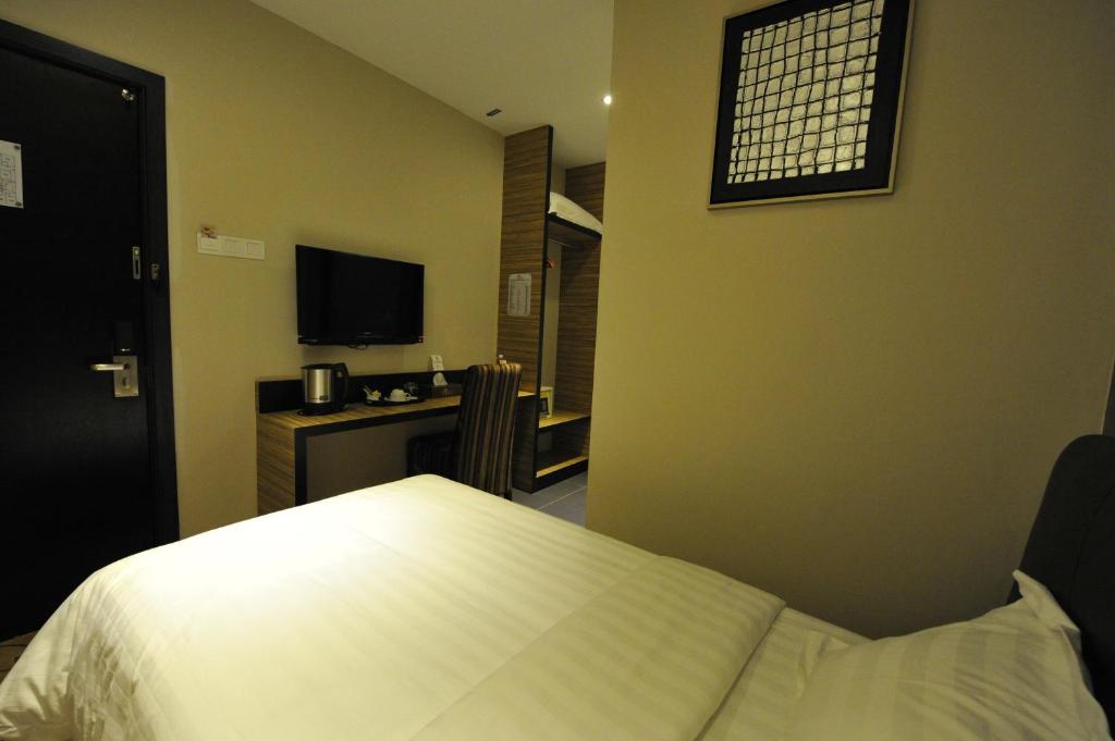 TV a/nebo společenská místnost v ubytování Milano Hotel