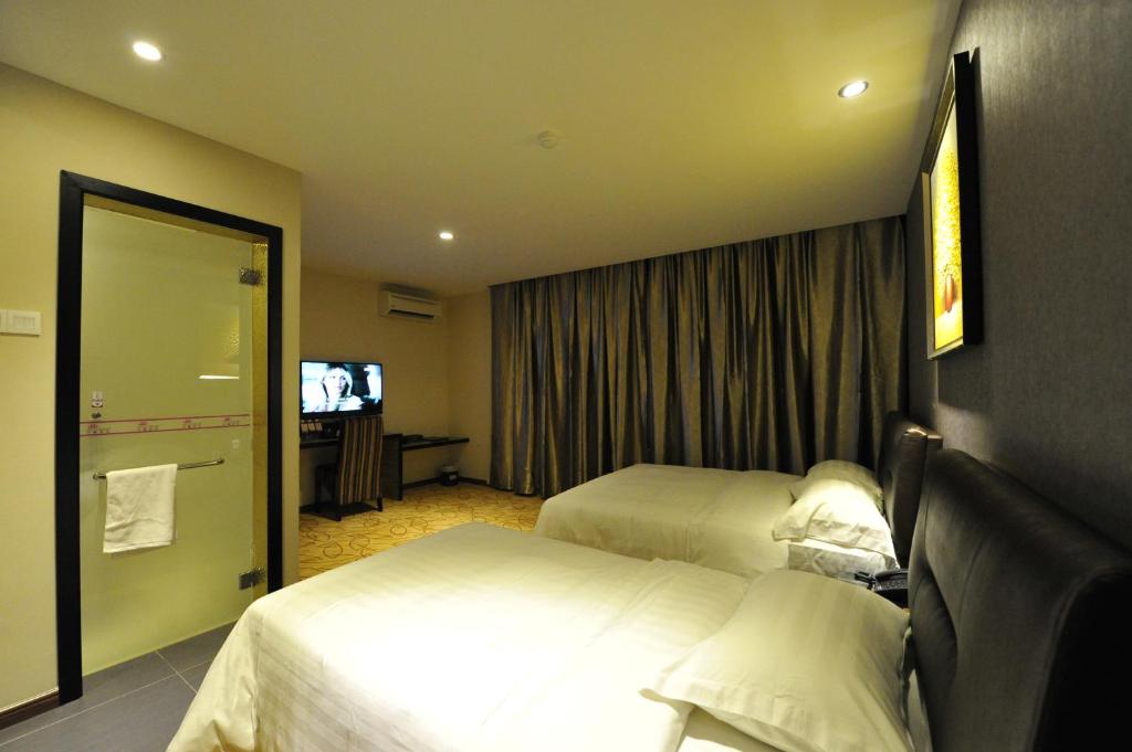 Postel nebo postele na pokoji v ubytování Milano Hotel