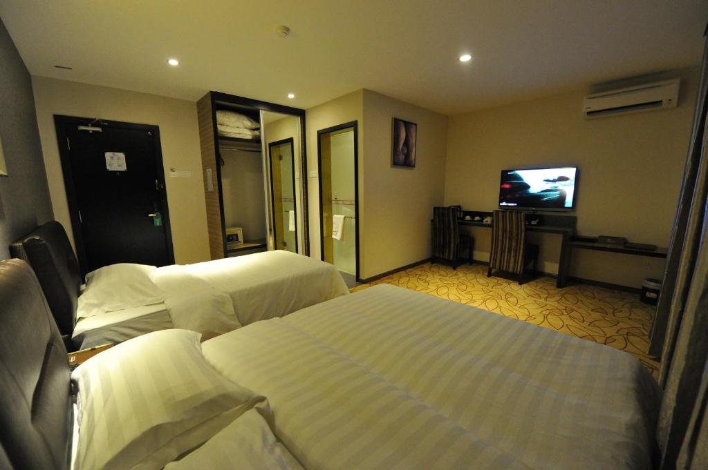 TV a/nebo společenská místnost v ubytování Milano Hotel