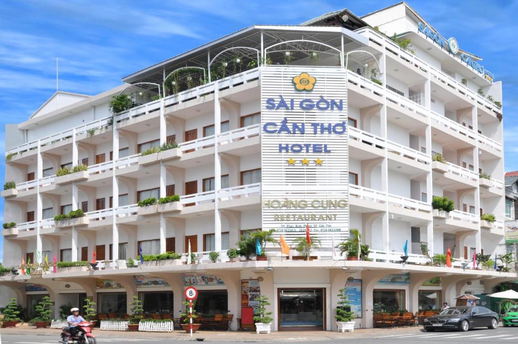 a white building with a sign on it at Saigon Can Tho Hotel in Can Tho