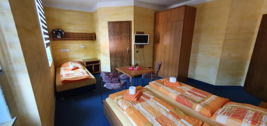 Postel nebo postele na pokoji v ubytování Alte Post zu Stetzsch