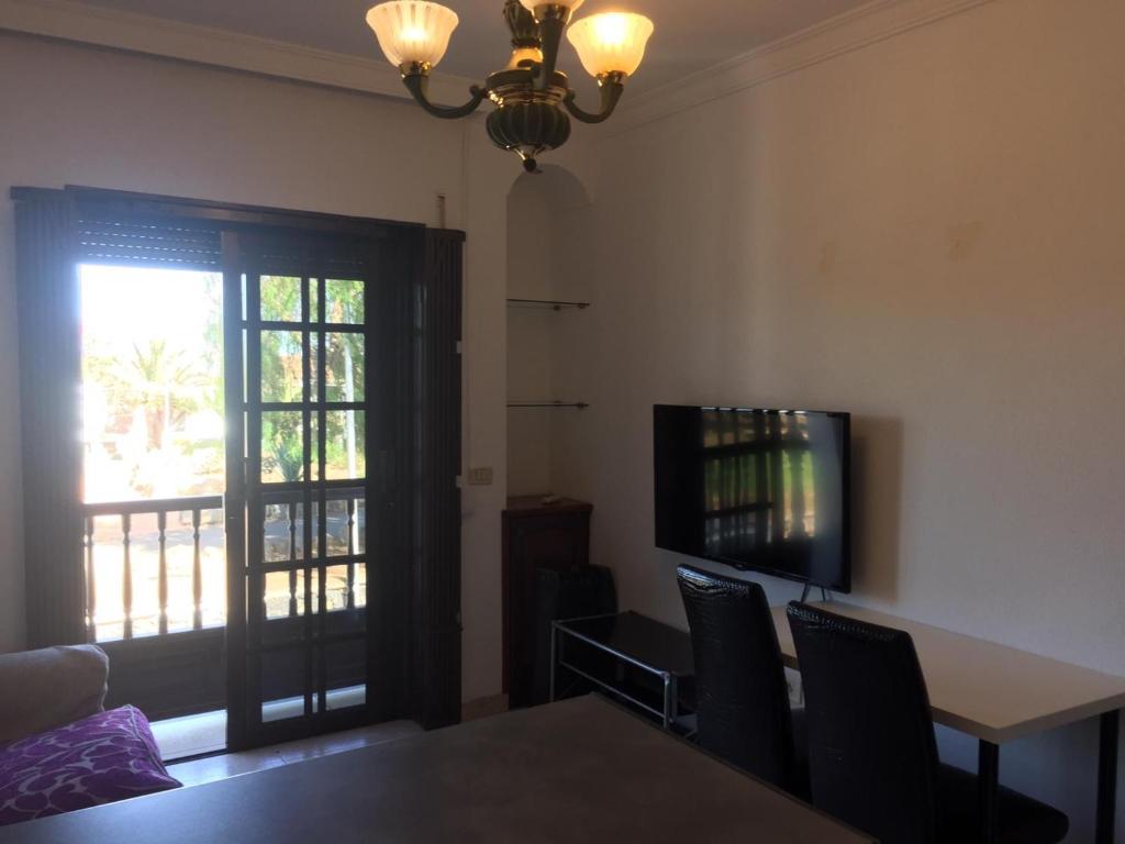 TV a/nebo společenská místnost v ubytování Guajara loft-balcon