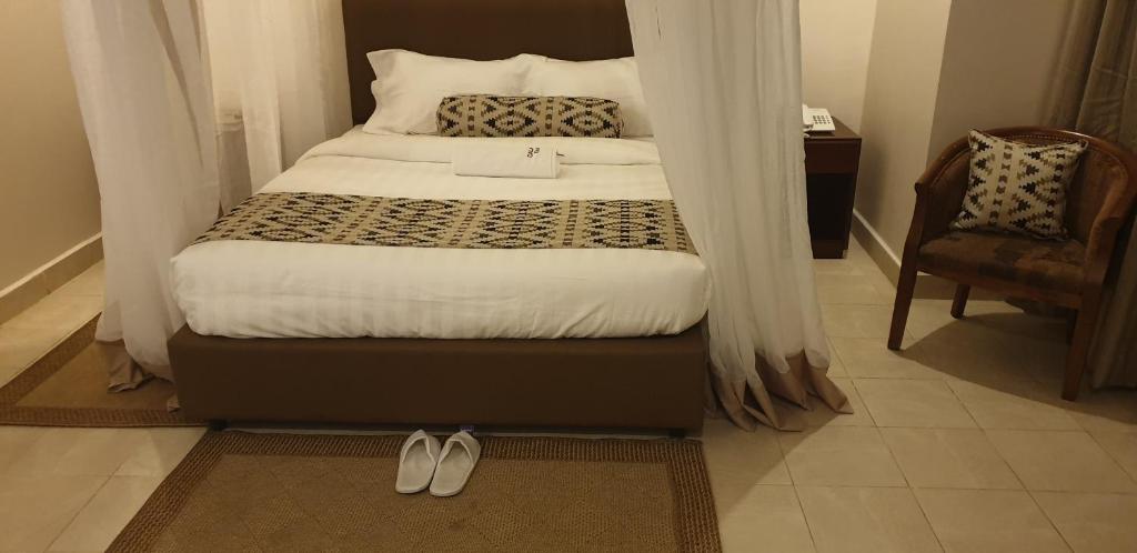 Ένα ή περισσότερα κρεβάτια σε δωμάτιο στο Calabash Express Hotel