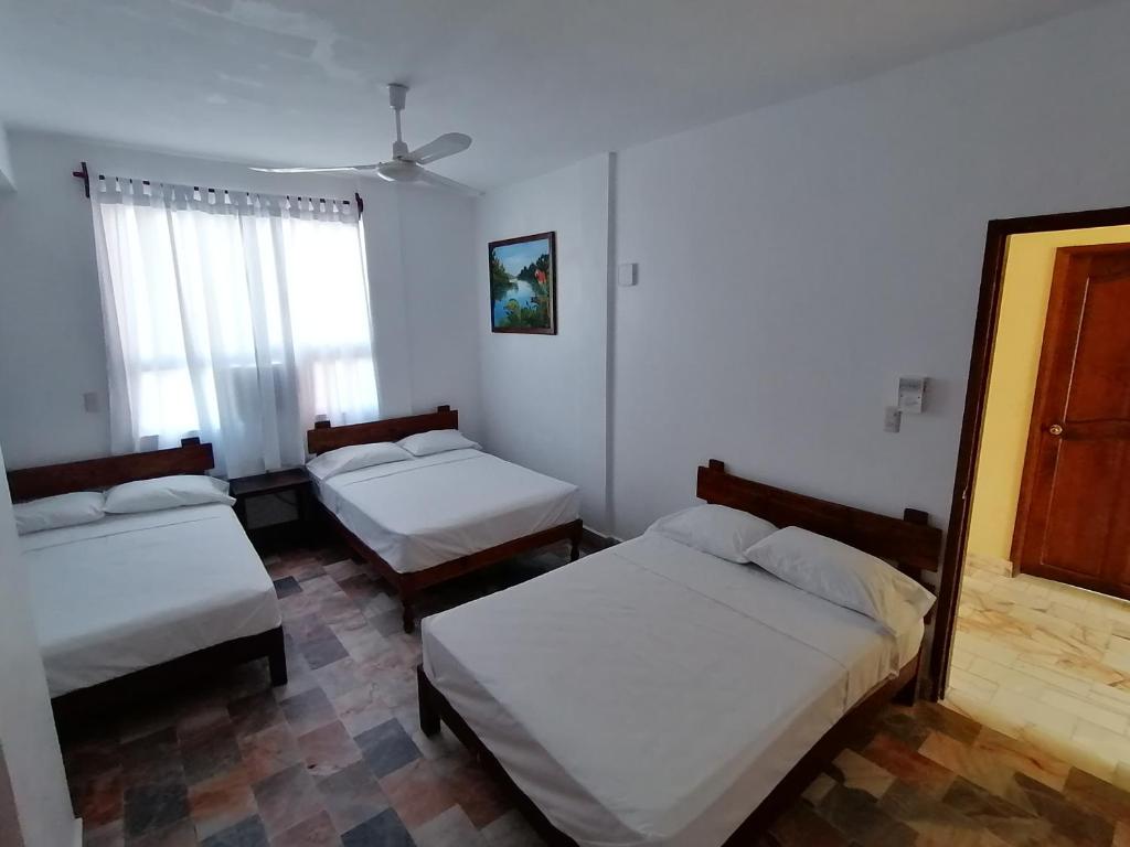 Postel nebo postele na pokoji v ubytování Don Luis Hostal - Sucursal Hidalgo - Tecolutla