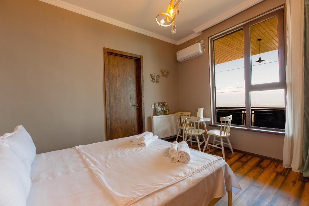 Postel nebo postele na pokoji v ubytování 4 Rooms