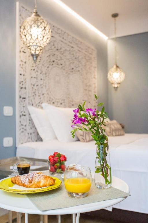 Una cama o camas en una habitación de Bellaroto Suite & SPA