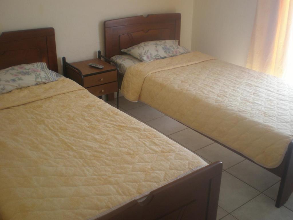 Postel nebo postele na pokoji v ubytování Filia Apartments