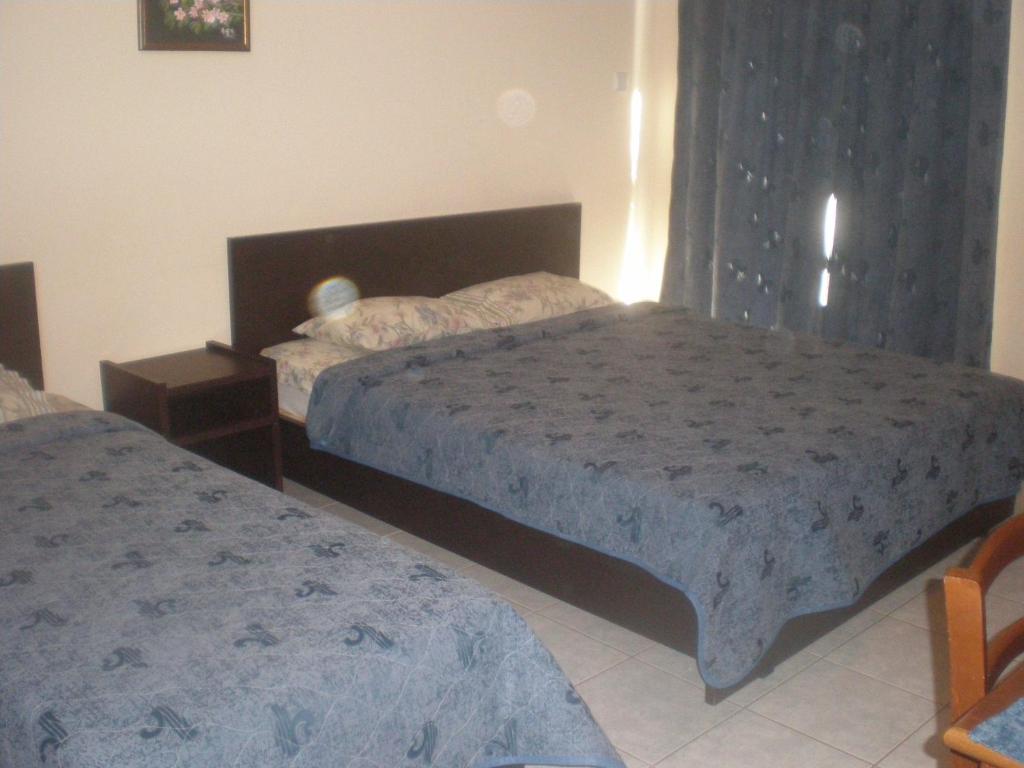 Postel nebo postele na pokoji v ubytování Filia Apartments