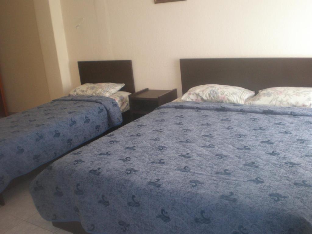 Postel nebo postele na pokoji v ubytování Filia Apartments