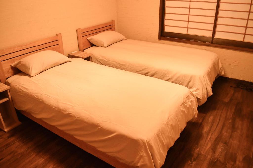 Postel nebo postele na pokoji v ubytování Hostel&Cafe Farolito