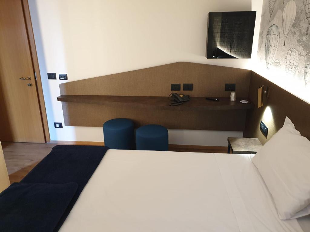 Postel nebo postele na pokoji v ubytování Hotel and Wellness Patriarca
